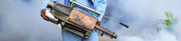 Fumigation technician using a fogger for deep pest treatment in Louisville, KY